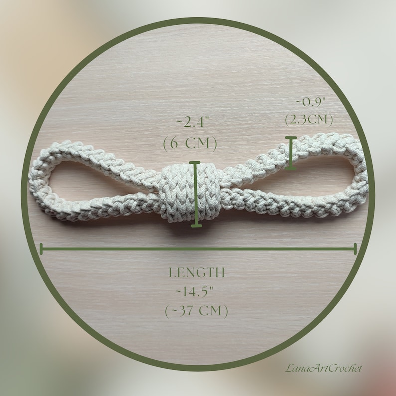 May include: An off-white crocheted rope toy with a central knot and two loops. The item measures approximately 14.5 inches in total length, with a central width of 2.4 inches and a loop thickness of 0.9 inches. The text LanaArtCrochet is visible.