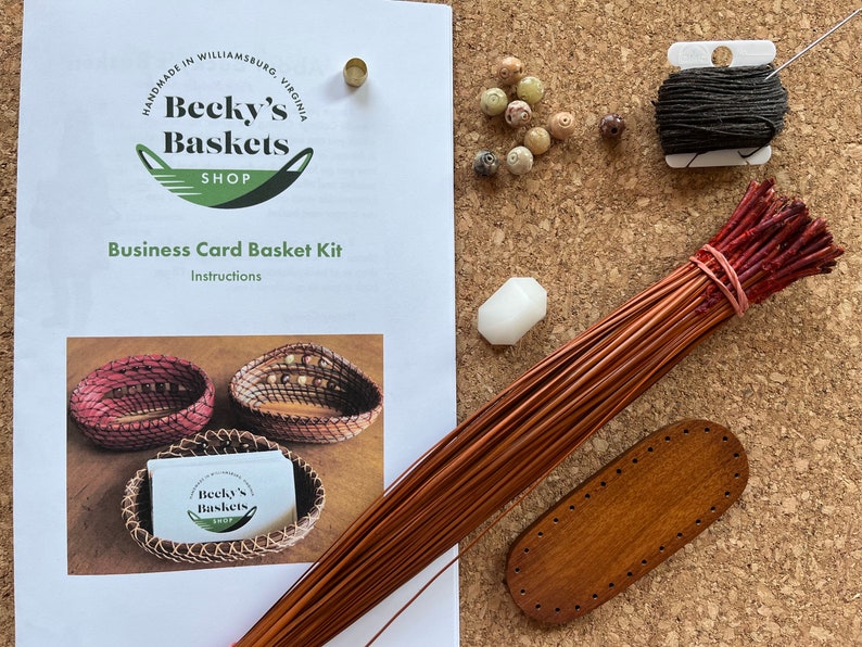 Photo of complete kit including instructions, pine needles, wood center, thread, sewing needle, beads, gauge, and beeswax.