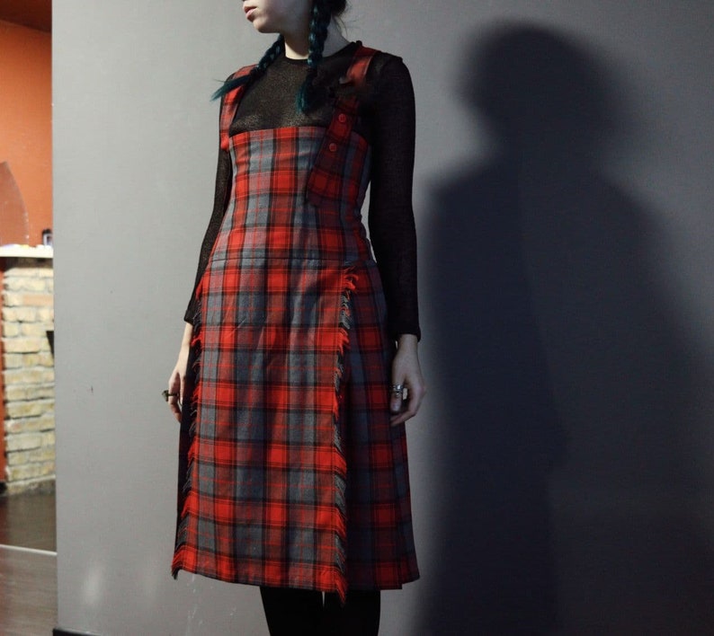 Vintage red tartan check dungaree dress with pleated skirt and fringe