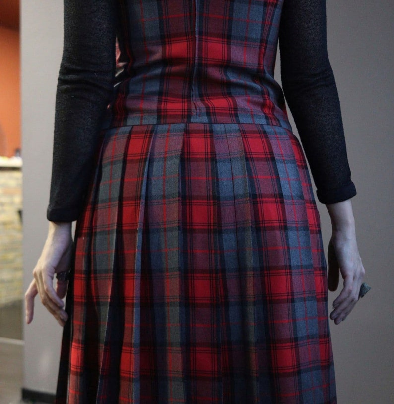 Vintage red tartan check dungaree dress with pleated skirt and fringe