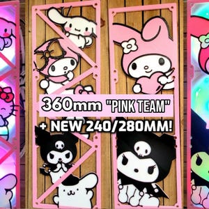 Puede incluir: Cubiertas de ventilador de computadora de temática rosa y negra con un diseño de personaje de dibujos animados. Las cubiertas son de 360 mm y presentan el texto "PINK TEAM" y "NEW 240/280MM!"