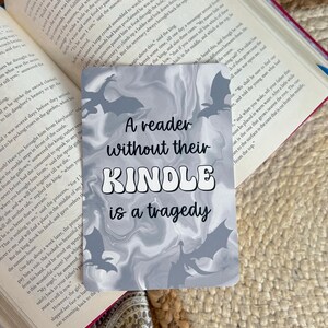 A reader without their kindle is a tragedy; grey marbled dragon fantasy aesthetic