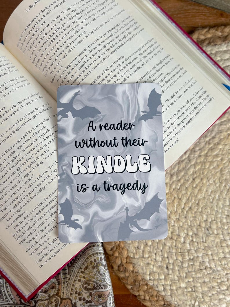 A reader without their kindle is a tragedy; grey marbled dragon fantasy aesthetic
