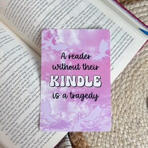 A reader without their kindle is a tragedy; pink dragon fantasy aesthetic