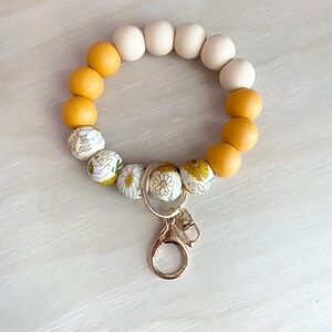 Car Key Holder Silicone Wristlet Keychain Beaded Design Bracelet Bangle Accessory Sunflower Pattern Boho Style Everyday Carry Solution Durable Construction Practical Gift Fashion Statement Piece Modern Look Gold Clasp Detail Teacher Present