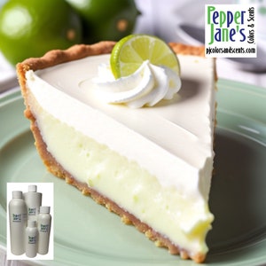 May include: A slice of key lime pie with whipped cream and a lime wedge on top. The pie is on a green plate. The text "Pepper Jane's Colors & Scents" is in the upper right corner of the image.