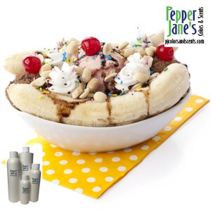 May include: A classic banana split in a white bowl, featuring a split banana, scoops of ice cream, whipped cream, peanuts, sprinkles, and cherries. The dessert sits on a yellow polka-dot napkin. The image includes bottles with the text "Pepper Jane's Colors & Scents".