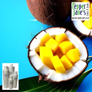 May include: A halved coconut filled with diced yellow mango. The coconut is on a blue background with green leaves. The image also includes a label for "Pepper Jane's Colors & Scents" with the website address "pjcolorsandscents.com".