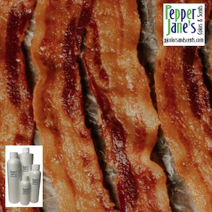 May include: Close-up of crispy, golden brown bacon strips on parchment paper. The bacon is cooked to perfection, with a slight char on the edges. The image is a close-up, so only the bacon is visible.