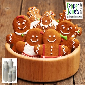 May include: A wooden bowl filled with gingerbread cookies decorated with white icing, red and green accents. The cookies are shaped like gingerbread people and a Christmas tree. The bowl is on a wooden surface. The text "Pepper Jane's Colors & Scents" is visible in the top right corner of the image.