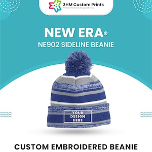 May include: A blue, gray, and white striped New Era NE902 Sideline beanie with a pom-pom. The beanie has a rectangular area for custom design. The text "YOUR DESIGN HERE" is visible. The image also includes the text "CUSTOM EMBROIDERED BEANIE".
