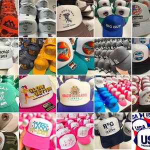 Collage of 20 custom Otto 39-165 trucker hats, each showcasing a unique DTF design or font style. The hats display a variety of colors and themes, demonstrating customization options available through 3HM Custom Prints.