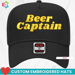 May include: Black trucker hat with the words "Beer Captain" embroidered in yellow on the front. The hat has a mid profile and a classic fit.