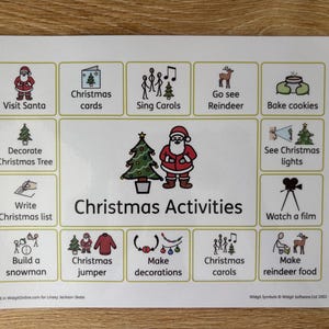 May include: A printed sheet titled "Christmas Activities" featuring festive illustrations. The images depict various Christmas traditions, such as singing carols, decorating a tree, and making decorations. The sheet is on a wooden surface.