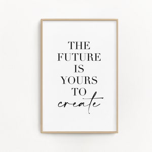 May include: A framed print with the text "THE FUTURE IS YOURS TO create" in black lettering on a white background.