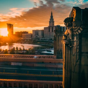 Canvas Print of Guardians of Traffic against Downtown Cleveland Skyline at Sunset