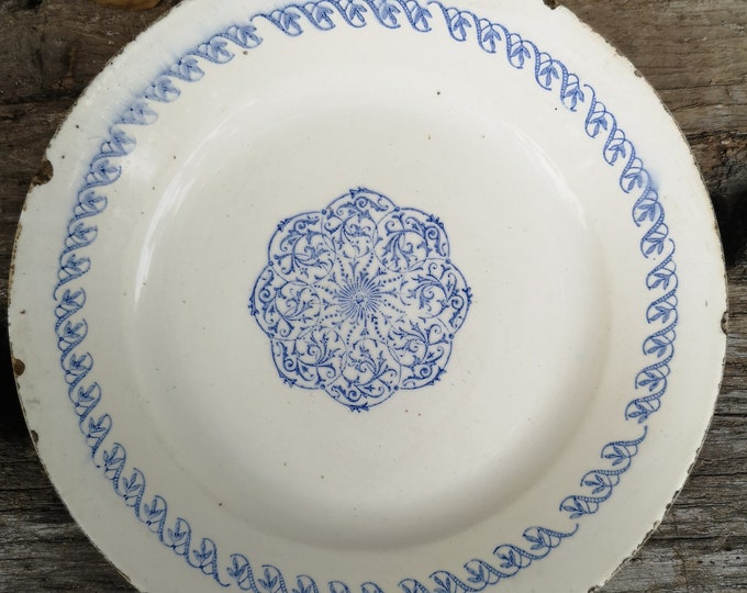 Antique ironstone faience terre de fer tin glazed plate with blue sponged or stamped decoration