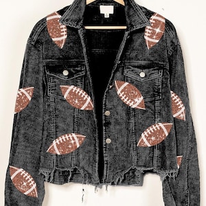 May include: A black corduroy jacket with a distressed hem and brown glitter football patches.