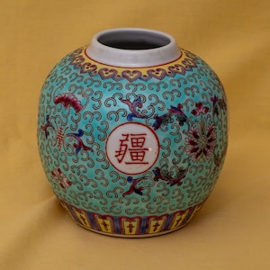Vintage blue Chinese ginger jar showing Chinese symbols meaning longevity. No lid.
