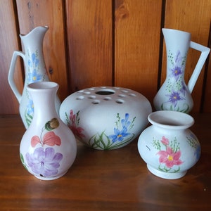 Various vintage hand painted items made by Radford Pottery. Vases and jugs.