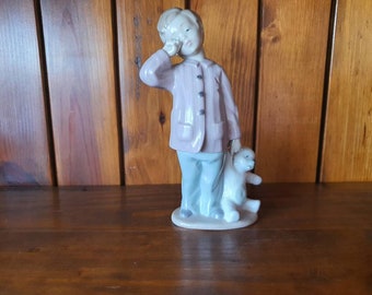 Nao Sleepy-Head porcelain boy figure.