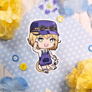 May include: A sticker featuring a cartoon character in a purple engineer's hat and overalls, saluting with a wrench in hand. The character has blonde hair and green eyes. The sticker is on a blue polka dot background with yellow and blue floral accents.