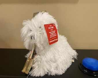 Switch adapted animated plush dog with music , “Deck the Halls+4”. Speech therapy, OT, special needs education, assistive technology, AAC