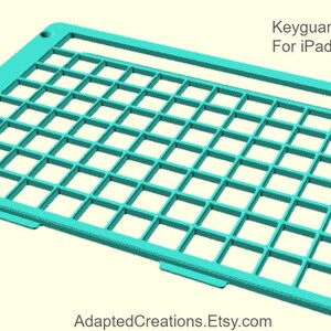 May include: A turquoise blue plastic iPad keyguard with a grid pattern. The text "Rug-Ed Case" is visible in the lower left corner. The text "Keyguard only listing For iPad 7, 8, or 9 (10.2)" is visible in the upper right corner.