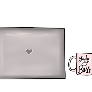 May include: A gray laptop with a heart shape on the screen and a pink mug with the text "Lady Boss" on it.