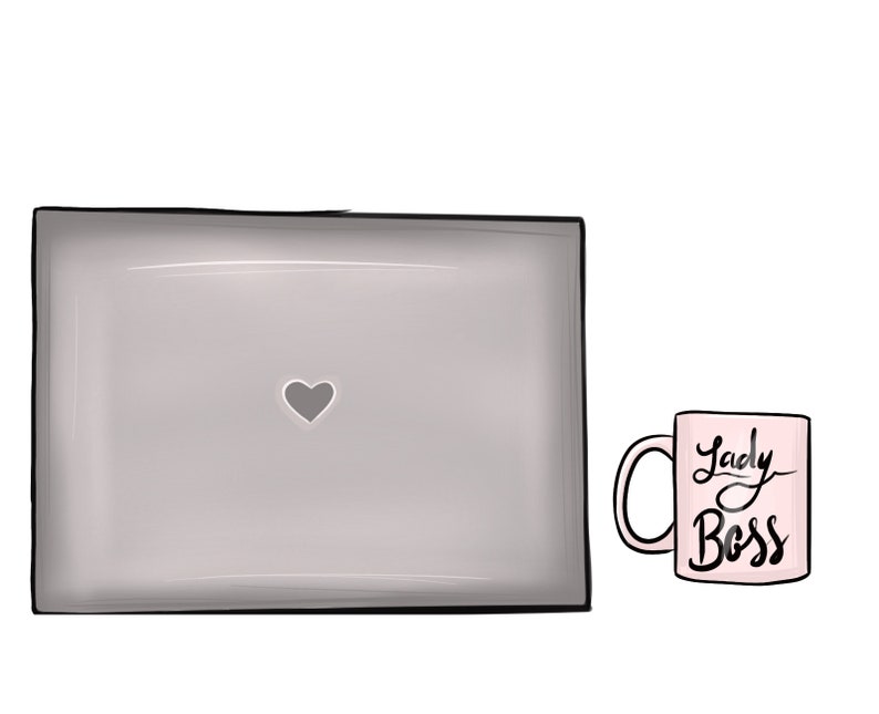 May include: A gray laptop with a heart shape on the screen and a pink mug with the text "Lady Boss" on it.