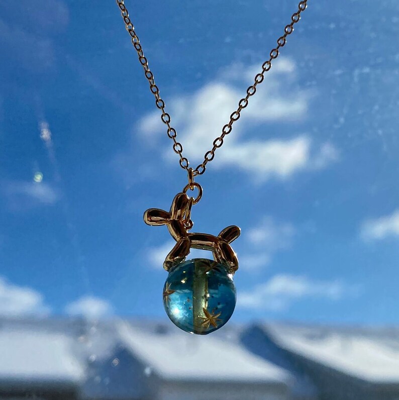 The Sky Blue planet bead is engraved with golden stars, offers a more translucent and captivating appearance.