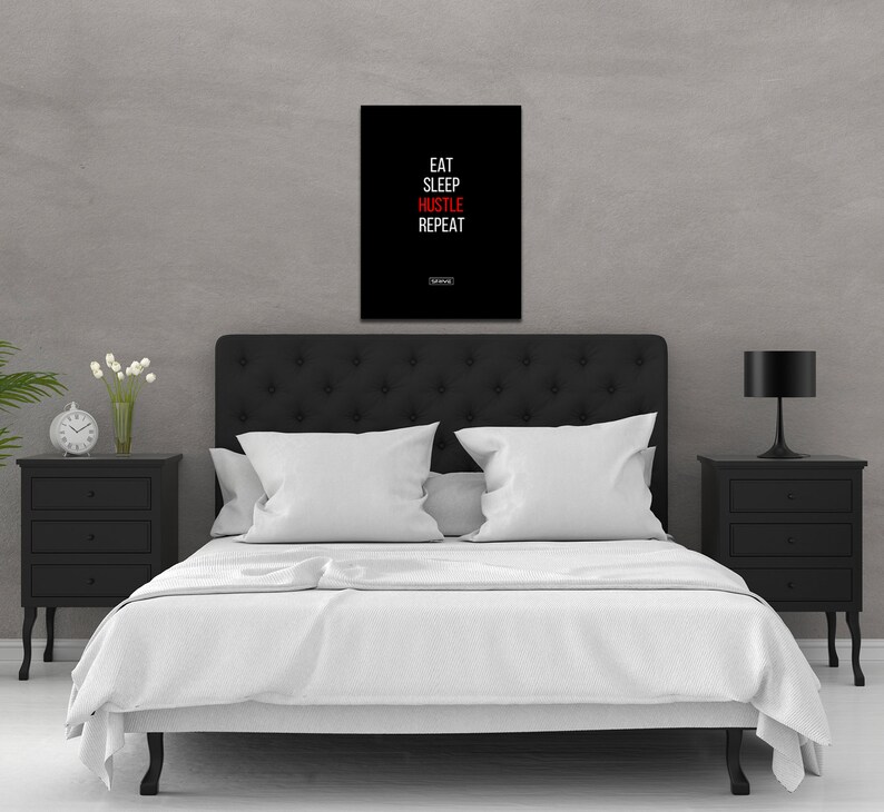 May include: Black and white motivational poster with the text "Eat Sleep Hustle Repeat" in white letters with the word "Hustle" in red.