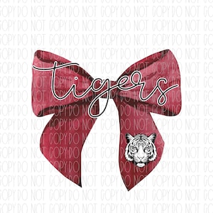May include: A red watercolor bow with the word "tigers" written in black script. A white tiger face is in the center of the bow.