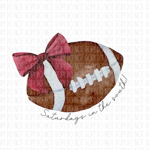 May include: A brown and white football with a red bow on top. The football has white laces and the text "Saturdays in the south!" is written below it.