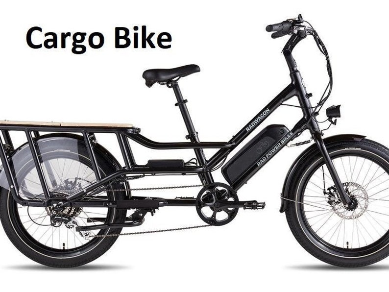 May include: A black RadWagon cargo bike with a wooden cargo bed, black fenders, and a black Rad Power Bikes battery. The bike has a black frame, black handlebars, and black wheels.