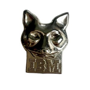 May include: Silver-toned metal pin featuring a stylized fox head with the word "IBM" below it.