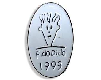 May include: White oval pin with a black line drawing of a cartoon face with a surprised expression. The text "Fido Dido 1993" is below the face.