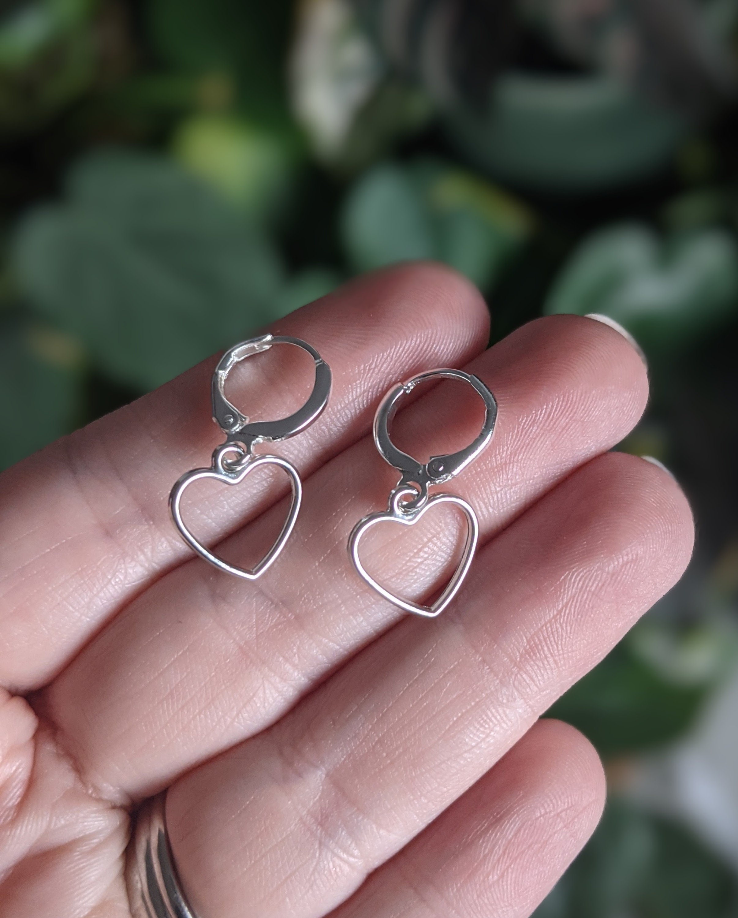 Silver hoop earrings hot sale with heart charm