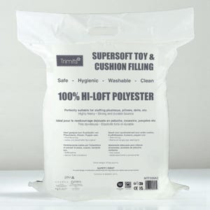 May include: A white bag of Trimits Supersoft Toy & Cushion Filling. The bag features the text "100% Hi-Loft Polyester" and is suitable for stuffing plush toys, pillows, and dolls. The bag is labeled as safe, hygienic, washable, and clean.