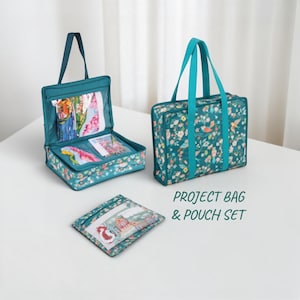 May include: A teal project bag and pouch set with a floral and bird pattern. The bag has teal handles and a zipper closure. The set includes a rectangular bag, a square pouch, and a smaller open bag, all with the same design. The text "PROJECT BAG & POUCH SET" is visible.