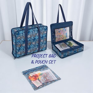 May include: A blue floral project bag and pouch set. The project bag has a zip closure and handles. The open pouch displays contents. The text "PROJECT BAG & POUCH SET" is printed on the image.