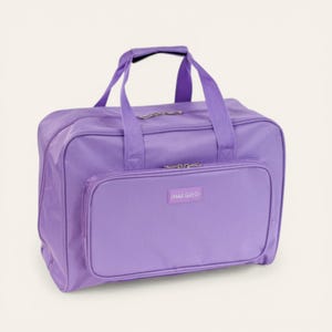 May include: A lilac travel bag with a top handle and shoulder straps. The bag features a zippered main compartment and a front pocket with a small label. The bag is made of a durable fabric.