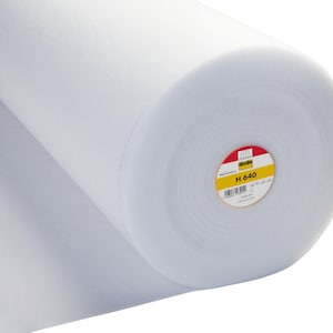 May include: A white roll of interfacing fabric with a yellow and red label that says "Vlieseline H 640".