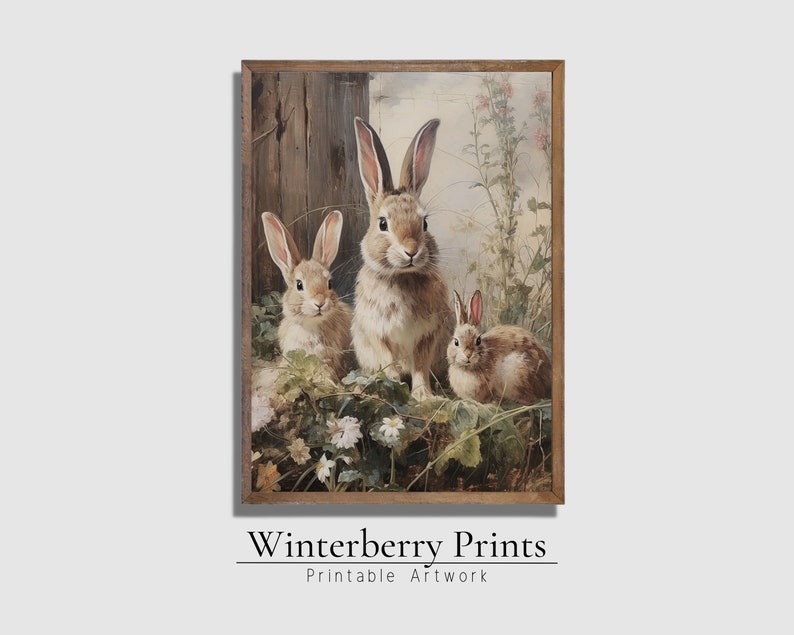 May include: A painting of three brown rabbits in a field of green plants and white flowers. The rabbits are looking at the viewer. The largest rabbit is in the center of the image, and the two smaller rabbits are on either side of it.