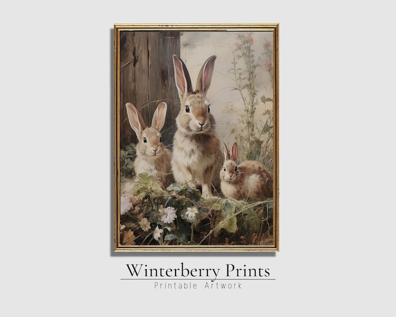 May include: A painting of three brown rabbits in a forest setting. The rabbits are sitting in a patch of green grass and flowers. The background is a blurred image of trees and foliage.