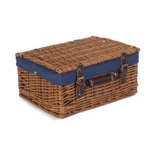 May include: A brown wicker picnic basket with a blue fabric lining and leather straps. The basket has a hinged lid and a carrying handle.