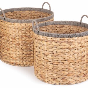 May include: Two woven baskets with grey rope handles and grey rope trim around the top.