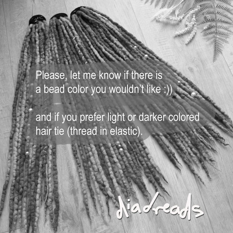May include: Three sets of long, textured synthetic dreadlocks in varying shades of gray and brown, each secured with a black hair tie. The dreadlocks are adorned with small, round metallic beads and include text overlay regarding bead and hair tie preferences.