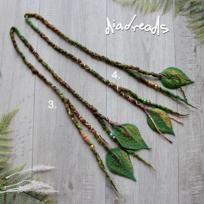 May include: Two long hair extensions labeled 3 and 4, featuring green and brown wrapped fibers, decorative beads, and felted leaf-shaped ends. The text "diadreads" is visible in the upper right corner of the image.