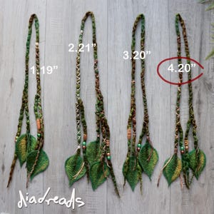 Four sets of green and brown hair extensions featuring felted leaf accents, braided textures, and small wooden and metallic beads. Each set is labelled with numerical identifiers 1. 19", 2. 21", 3. 20", and 4. 20" (length in inches), with the text Diadreads below.